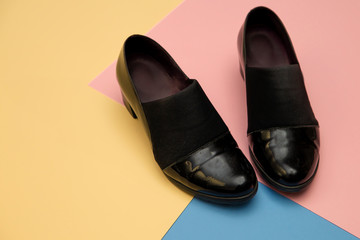 pair of black shoes on colorful background