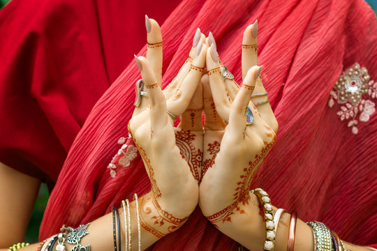 Beautiful Woman In Traditional Muslim Indian Wedding Pink Red Dress With Henna Tattoo Jewelry Bracelets Do Hands Nritta Odissi Samyuta Hasta Mudras Dance Movement Lotus Bud Flower Concept Background