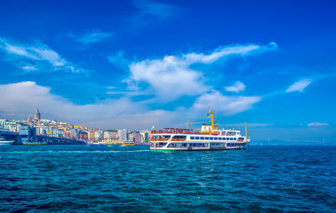 Muslim architecture and water transport in Turkey - Beautiful View touristic landmarks from sea voyage on Bosphorus. Cityscape of Istanbul at sunset - old mosque and turkish steamboats, view on Golden