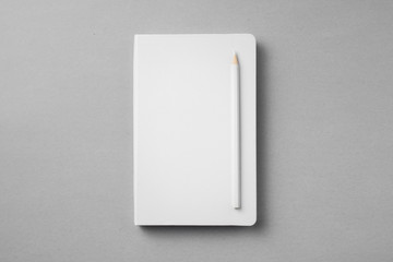 white notebook isolated on grey background