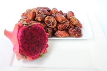 dragon fruit and date or kurma, two fruits that are suitable for health, the concept of food in the...