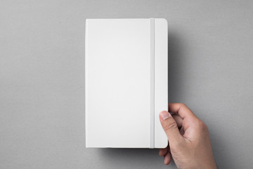 white notebook isolated on grey background