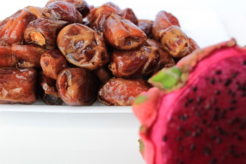 dragon fruit and date or kurma, two fruits that are suitable for health, the concept of food in the month of Islamic Ramadan