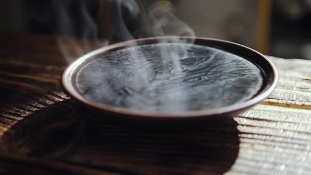 Bowl with a hot tea