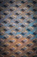 Closeup of a rusty manhole cover