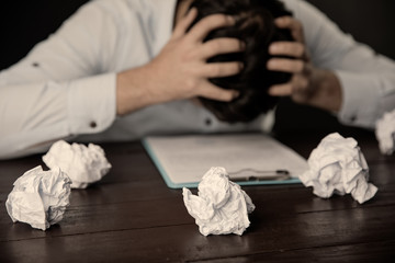 sad man in head with papers