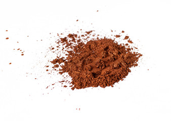 Natural orange colored satin pigment. Loose cosmetic powder. Eyeshadow pigment isolated on a white background, close-up