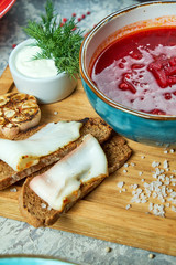 Red soup. Beautiful serving dishes. Restaurant menu