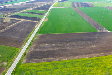 Road passing cultivated spring fields