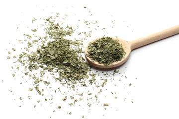 Sliced dry celery pile with wooden spoon isolated on white background