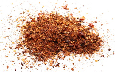 Crushed, ground dry pepper, spicy chopped paprika isolated on white background