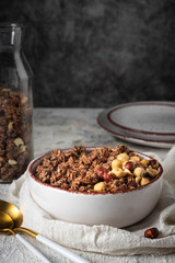healthy breakfast granola in a plate with nuts,  copy space