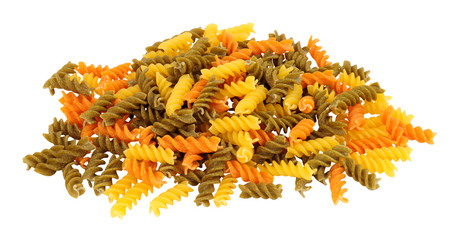 Group of uncooked tricolore fusilli pasta twist shapes isolated on a white background
