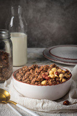 healthy breakfast granola in a plate with nuts,  copy space