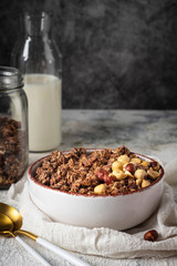 healthy breakfast granola in a plate with nuts,  copy space