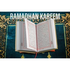 An islamic concept for Ramadhan. Flat lay composition of Qoran, Dates and a tasbih (rosary beads) on top of a sajadah (praying mattress)