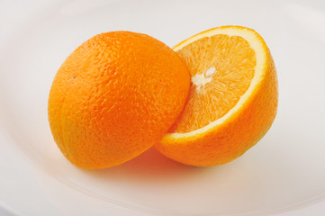 Fresh slised oranges isolated on the gray background