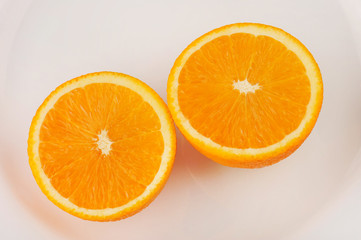 Fresh slised oranges isolated on the gray background