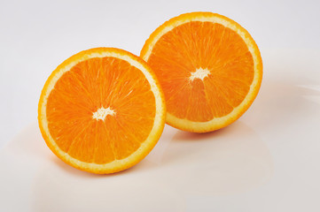 Fresh slised oranges isolated on the gray background