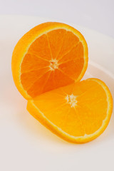 Fresh slised oranges isolated on the gray background