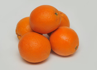 Fresh oranges isolated on the gray background