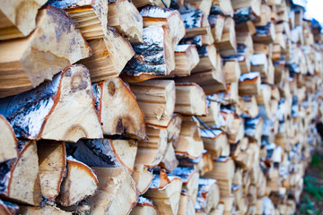 Woodpile of birch firewood. Preparation of wood for the oven. wood background. Preparation for winter