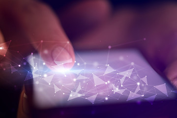 Finger touching phone with human network concept and dark background
