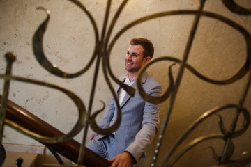 Portrait of a young male businessman in stylish clothes