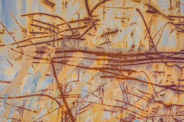 Old metal scratched background where the paint is already peeling off