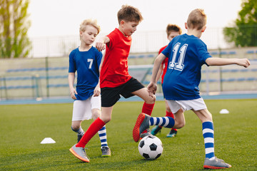 Young Football Players Kicking Ball on Soccer Field. Soccer Horizontal Background. Youth Junior...