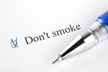 Don't smoke. Filling in the questionnaire, documents. The checkboxes are filled with a black pen on a white background. Questionnaire, survey.