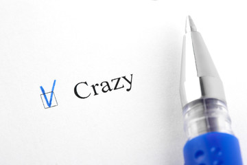 Crazy. Filling in the questionnaire, documents. The checkboxes are filled with a black pen on a white background. Questionnaire, survey.