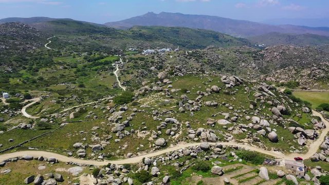 Aerial drone video of Lunar landscape with big round granite stones a unique geological phenomenon in Volax village, Tinos island, Cyclades, Greece
