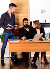 Working in male dominated job. Woman attractive lady working with men colleagues. Office collective concept. Coworkers communicate solving business tasks. Working together. Managing process