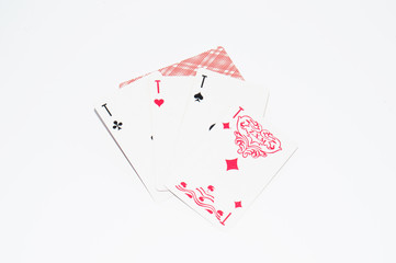 Deck of playing cards and four aces on white background, copy space for text