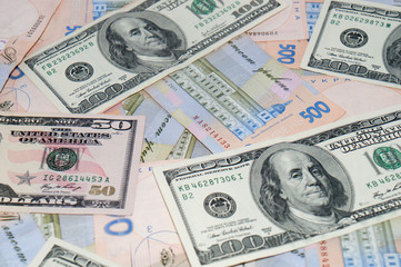 Money, dollars and hryvnia, close-up, top view. The concept of the dollar and the hryvnia, finance, banks.