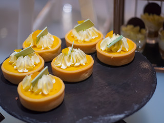 Dessert concept, sweet dessert in cafe, Cake on black wooden.