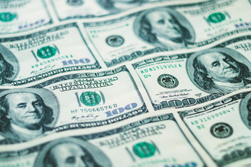 Closeup American dollars banknotes background. US 100 dollars pattern.