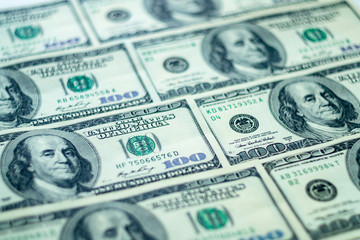 Closeup American dollars banknotes background. US 100 dollars pattern.