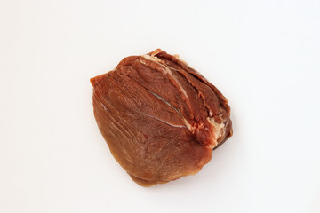 Pork flesh isolated on white background, top view