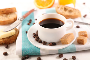 coffee cup with sugar, bread and butter