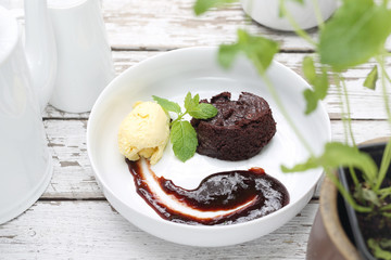 Brownie, cake with a scoop of vanilla ice cream and fruit mousse.