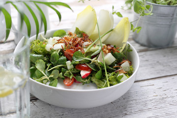 Healthy natural food. Salad with green vegetables, vitamins on the plate.