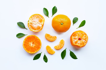 Orange fruits and green leaves on a white background.