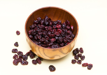 Pile of dried cranberries Dried cranberries in a bowl on white background. Closeup