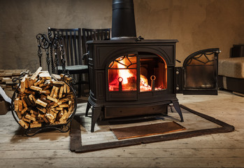 burning wood in the stove in country house - 267082933