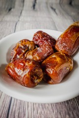 A Tamar (Dates)  against wooden background