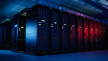 Shot of Data Center With Multiple Rows of Fully Operational Server Racks. Modern Telecommunications, Artificial Intelligence, Supercomputer Technology Concept. Shot in Dark with Neon Blue, Pink Lights - obrazy, fototapety, plakaty