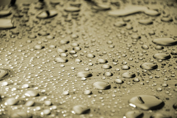 Fototapeta na wymiar Close up water drops on metal surface can be used for web design