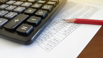 Calculator and pencil on paper